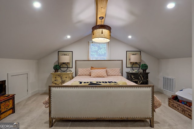 bedroom with vaulted ceiling and light colored carpet