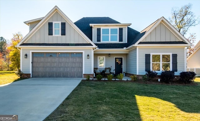 view of front of home with a garage and a front lawn