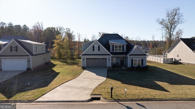 view of front property featuring a front yard and a garage