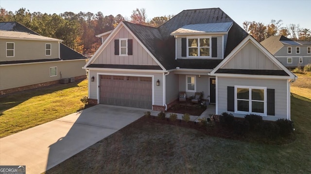 view of front facade featuring a front lawn and a garage