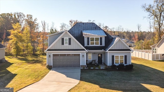 view of front of property with a garage and a front yard