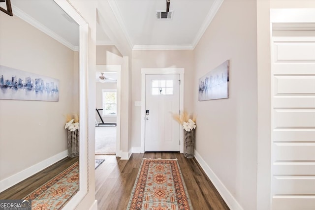 entrance foyer featuring crown molding and dark hardwood / wood-style floors