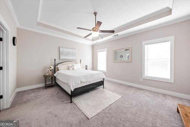 bedroom with a tray ceiling, ceiling fan, and crown molding