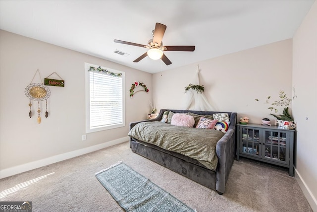 carpeted bedroom with ceiling fan