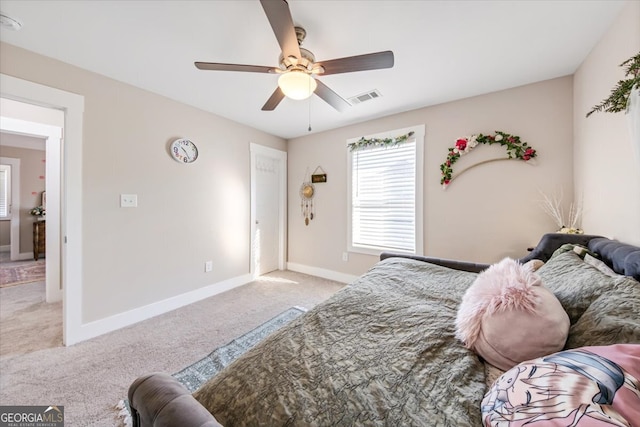 bedroom featuring light carpet and ceiling fan