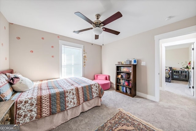 bedroom with ceiling fan and light colored carpet