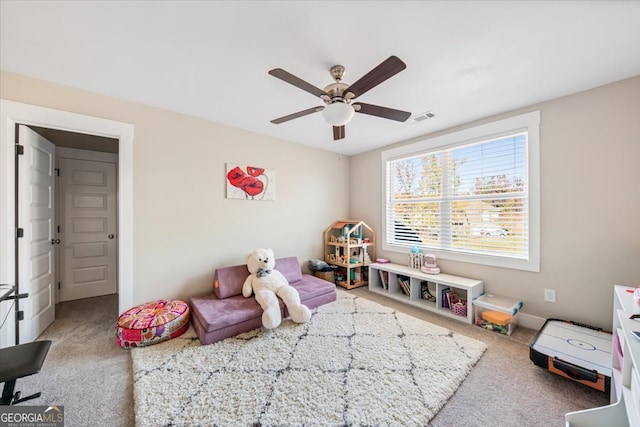 game room with ceiling fan and carpet floors