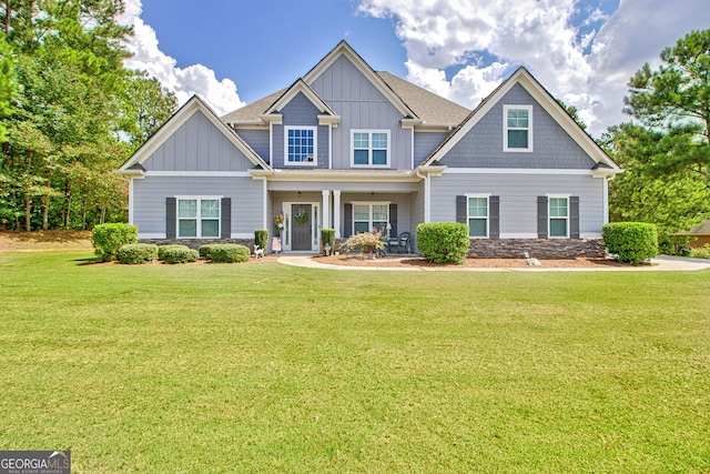 craftsman-style home with a front yard