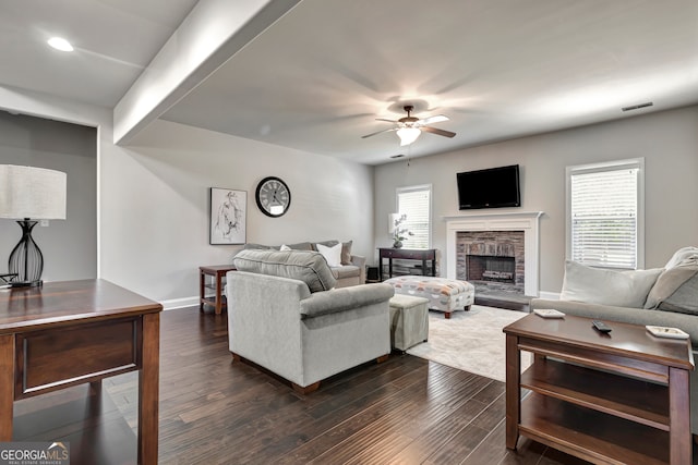 living room with dark hardwood / wood-style floors and ceiling fan