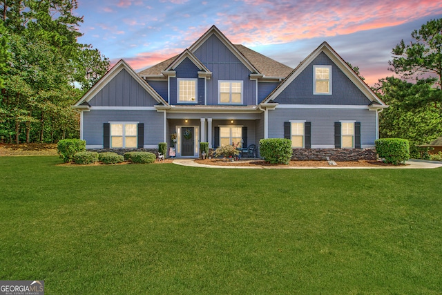 craftsman inspired home featuring a yard