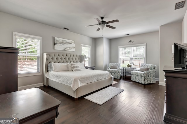 bedroom with ceiling fan and dark hardwood / wood-style floors