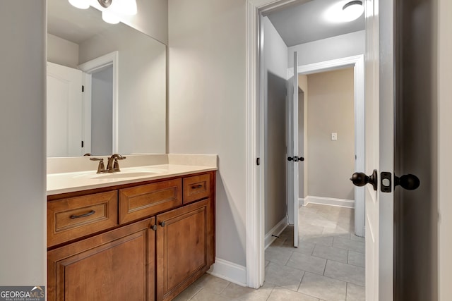 bathroom with tile patterned floors and vanity