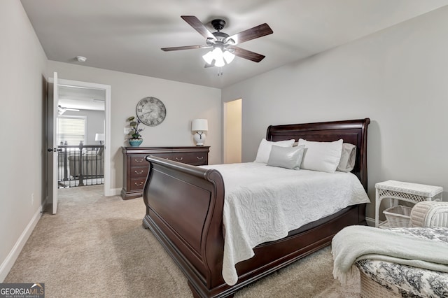 bedroom with light colored carpet and ceiling fan