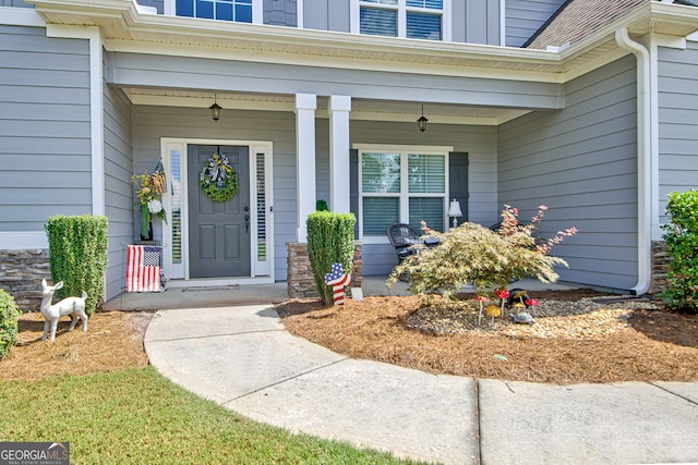 entrance to property featuring a porch