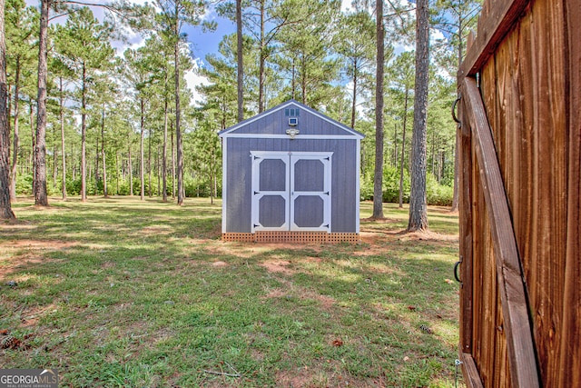 view of outbuilding with a lawn