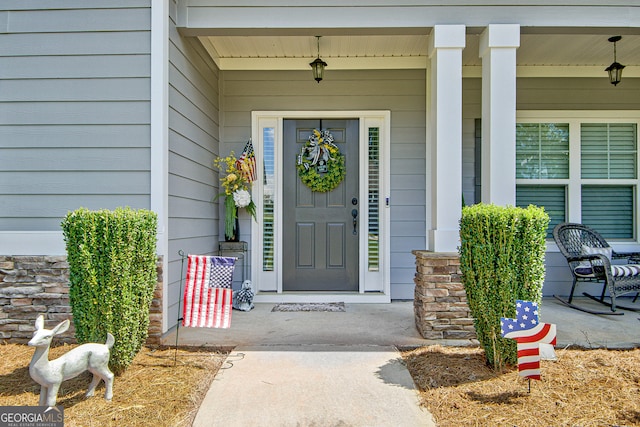 property entrance with covered porch