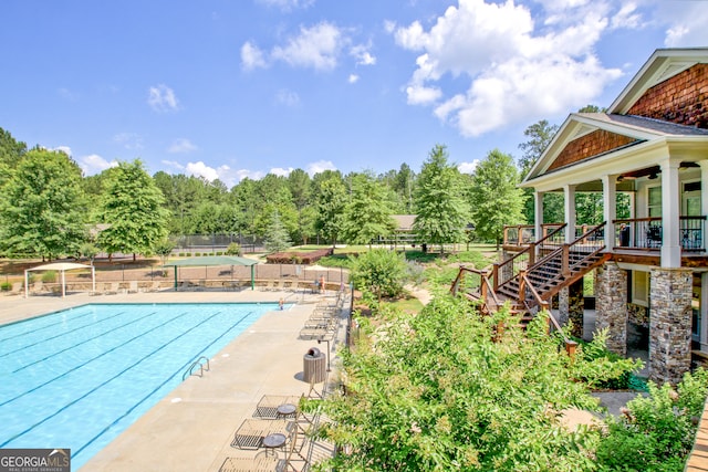 view of swimming pool with a patio