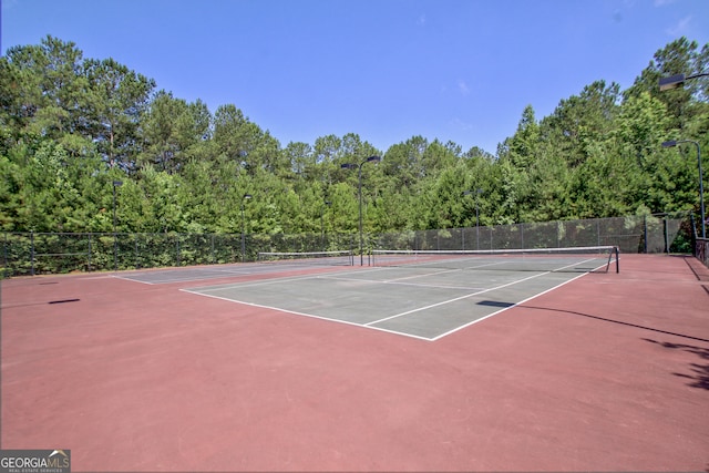 view of sport court featuring basketball hoop