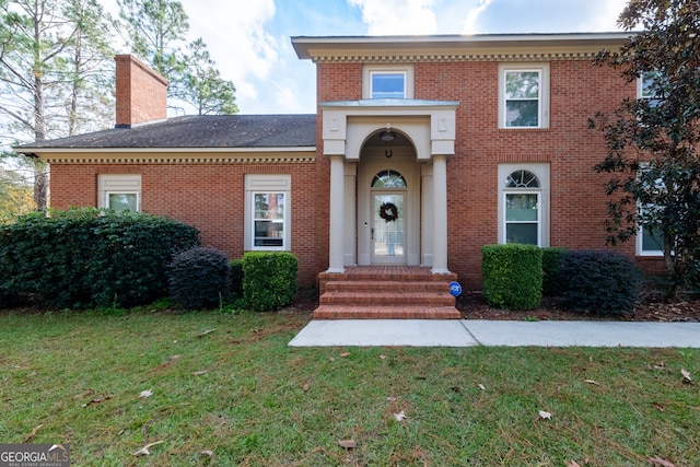 view of front facade featuring a front yard