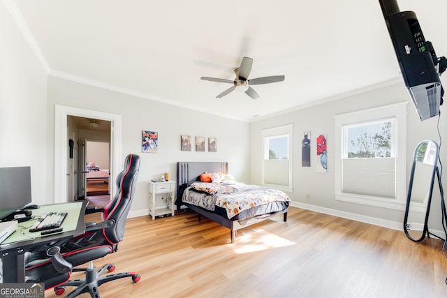 bedroom with hardwood / wood-style floors, ceiling fan, and crown molding