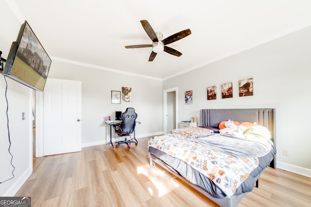 bedroom with ceiling fan, light wood-type flooring, and ornamental molding