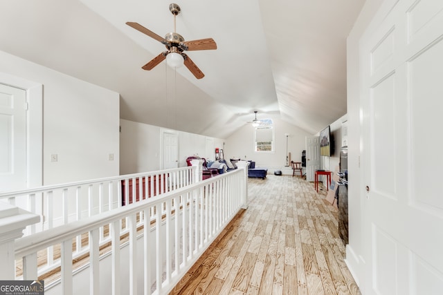 bonus room with ceiling fan, light hardwood / wood-style floors, and vaulted ceiling