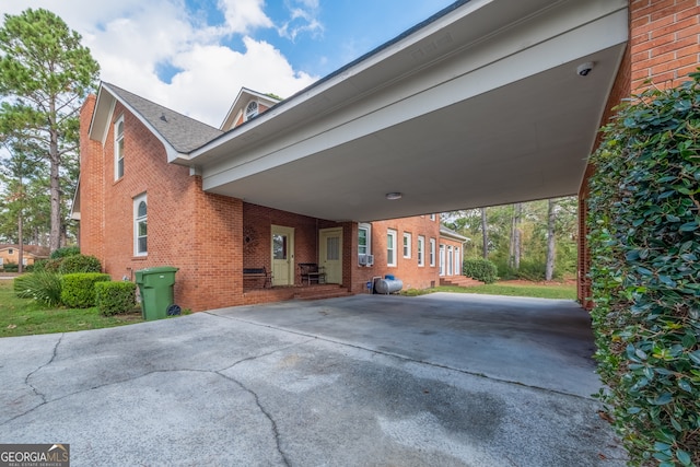 view of side of home with a carport