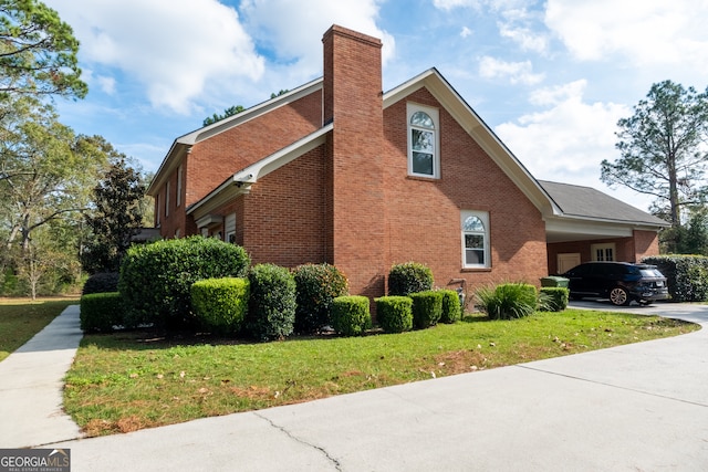 view of property exterior featuring a carport and a lawn