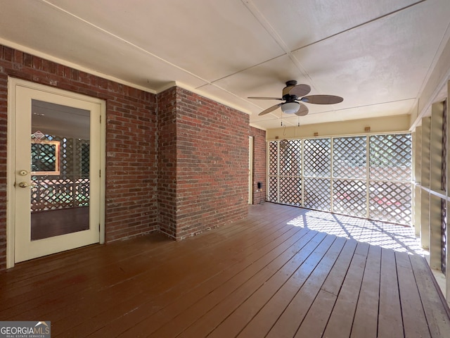 wooden terrace featuring ceiling fan