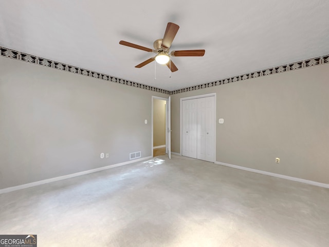 empty room featuring carpet and ceiling fan