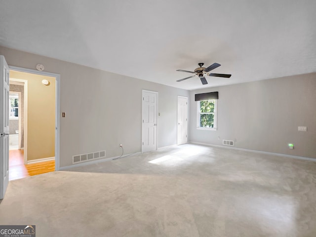 carpeted empty room with ceiling fan