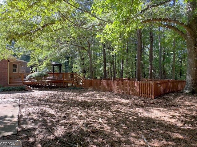 view of yard featuring a deck