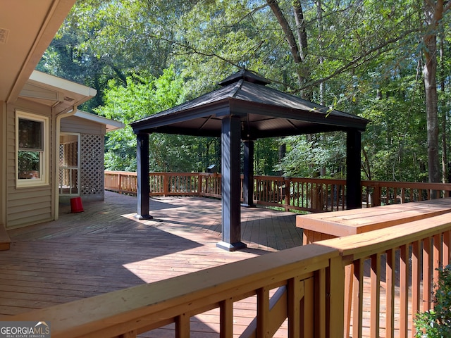 wooden deck featuring a gazebo