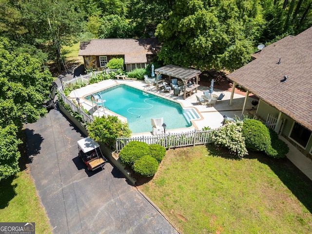 view of swimming pool featuring a patio and a pergola