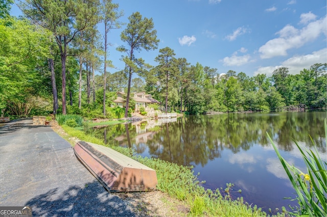 surrounding community with a water view