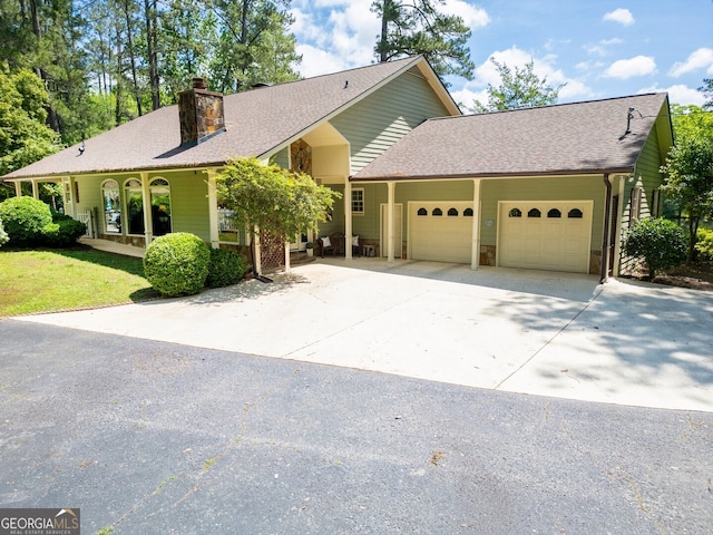 ranch-style house featuring a garage