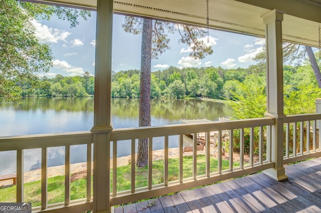 exterior space featuring a water view and a wealth of natural light