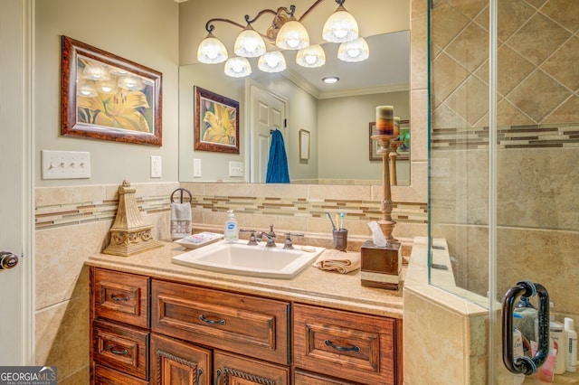 bathroom featuring walk in shower, vanity, tile walls, and ornamental molding