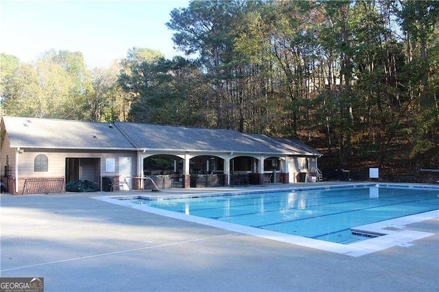 view of pool featuring a patio area