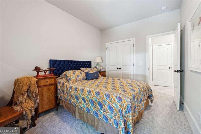 carpeted bedroom with a closet