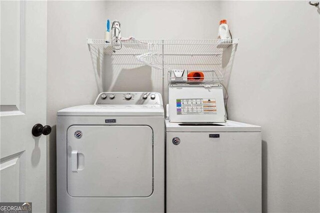 washroom with washer and dryer