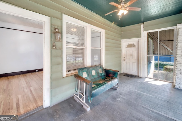 interior space featuring ceiling fan and covered porch