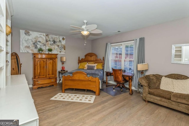 bedroom with ceiling fan and light wood-type flooring