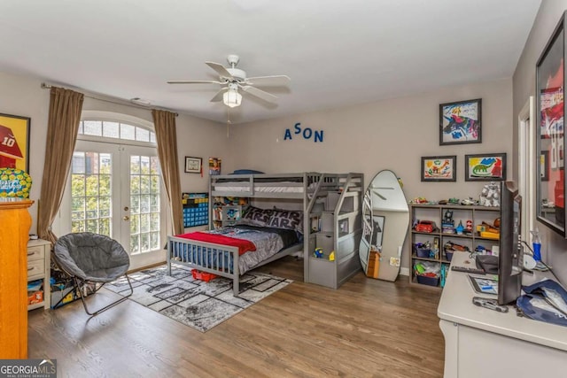 bedroom with access to exterior, wood-type flooring, french doors, and ceiling fan