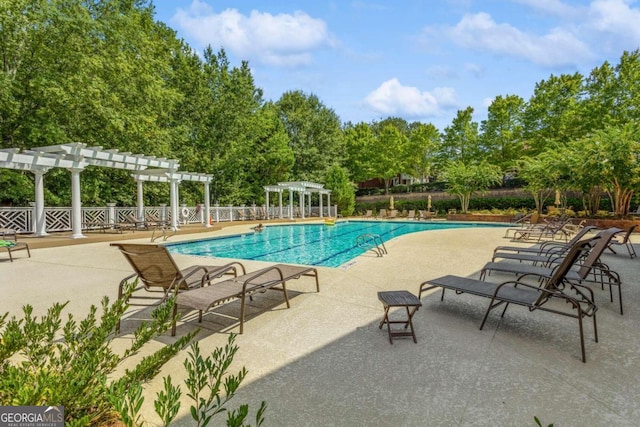 view of swimming pool featuring a pergola and a patio area