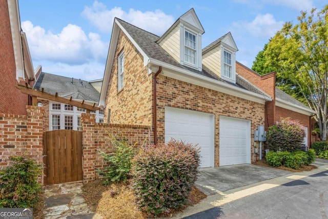 view of side of home with a garage