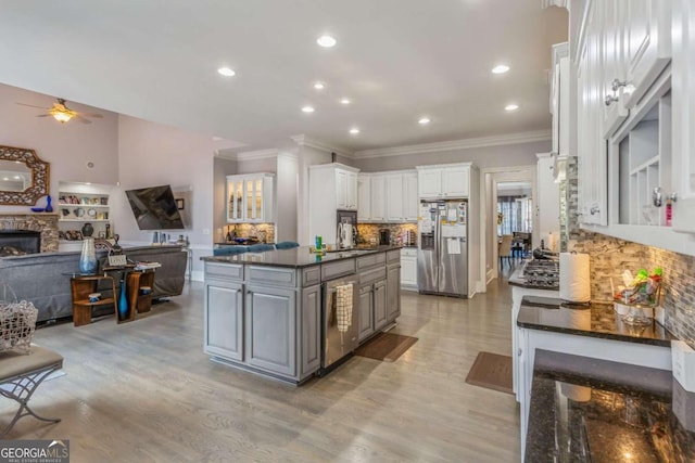 kitchen with gray cabinetry, ceiling fan, stainless steel refrigerator with ice dispenser, backsplash, and white cabinets