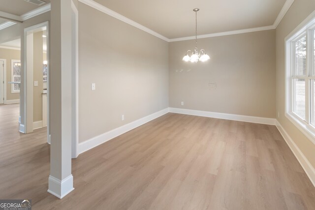 unfurnished living room featuring light hardwood / wood-style flooring, ceiling fan, and ornamental molding