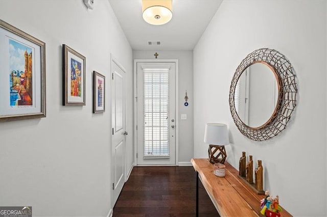 doorway to outside featuring dark hardwood / wood-style flooring