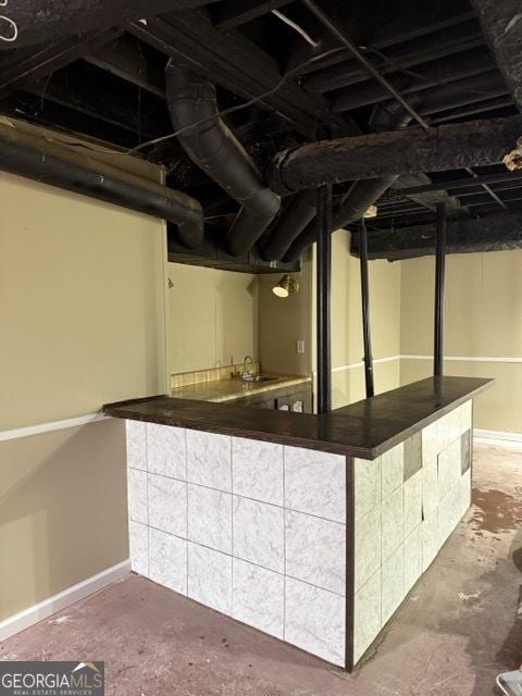 interior space featuring concrete flooring and sink